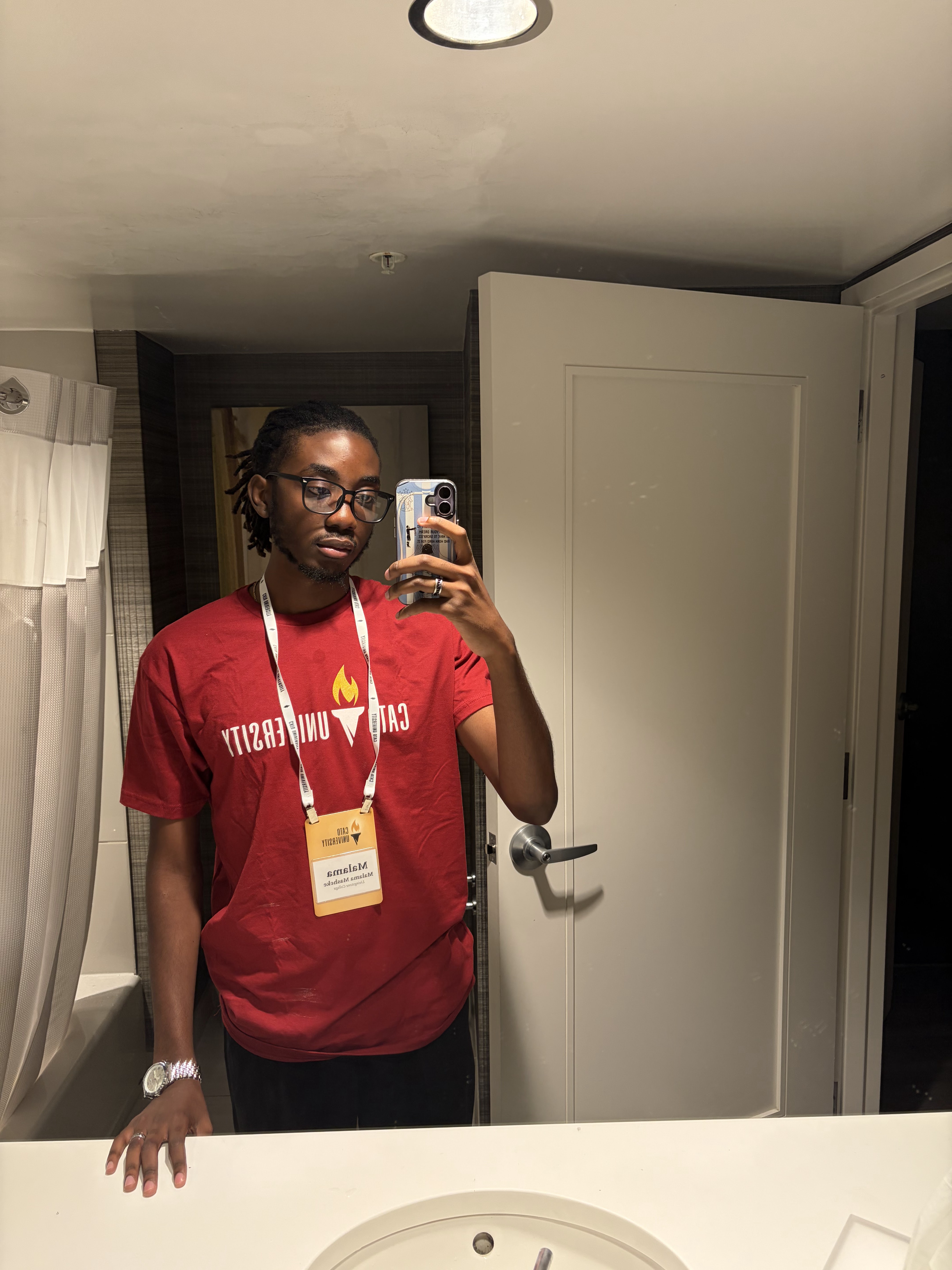 Wearing a Cato University conference badge at Cato University 2026